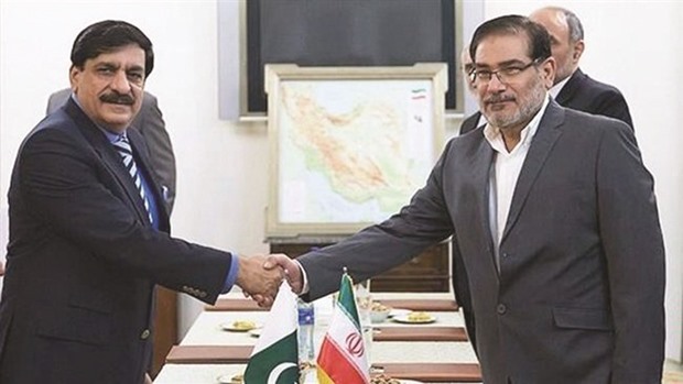 Secretary of Iranu2019s Supreme National Security Council Ali Shamkhani (right) shakes hands with Pakistani National Security Adviser Nasser Khan Janjua in Teheran on July 26.