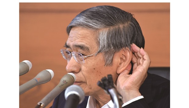 Bank of Japan governor Haruhiko Kuroda gestures as he listens to questions during a press conference in Tokyo. The BoJ surprised markets yesterday with only minor tweaks to its giant stimulus plan that reignited concerns its monetary policy arsenal is almost empty.