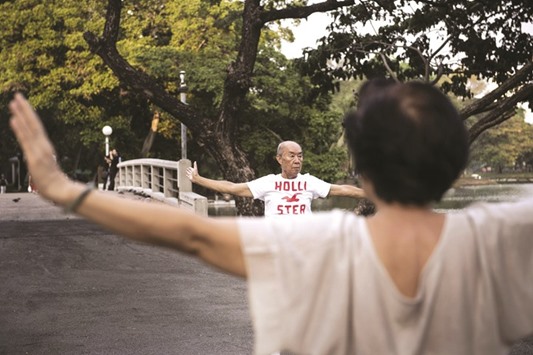 This photo taken on March 8 shows an elderly couple performing Tai Chi at a park in Bangkok. Adult children in Thailand often care for their parents, with the importance of filial responsibility drummed into kids at an early age. But these duties are getting tougher, with the share of elderly Thais expected to double over the next half century to some 17mn people, shrinking the workforce and placing a huge burden on the welfare and medical systems.