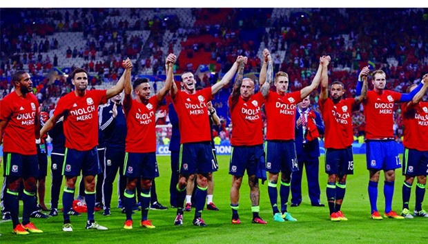 Wales players don T-shirts bearing the words u2018DIOLCHu2019 and u2018MERCIu2019 u2014 u2018thank youu2019 in Welsh and French respectively after Wednesdayu2019s semi-final against Portugal. (Reuters)