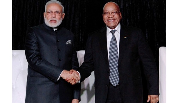 South African President Jacob Zuma (R) and Indian Prime Minister Narendra Modi shake hands as they attend the South Africa-India Business Forum at the CSIR International Convention Centre in Pretoria, yesterday.