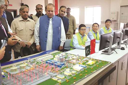 Pakistani Prime Minister Nawaz Sharif listens as experts explain a process of the Haveli Bahadur Shah LNG power plant during the inauguration in Jhang, Pakistan July 7, 2017.