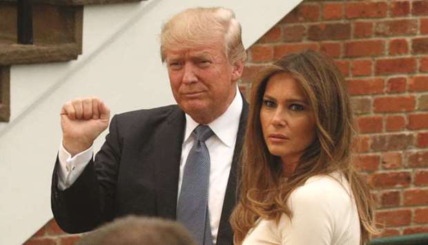 US President Donald Trump and First Lady Melania Trump arrive for dinner at Trump National Golf Club in Bedminster, New Jersey.