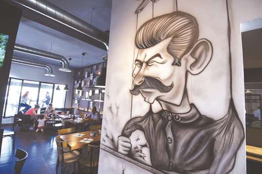 Cartoons adorn the walls of Le Dictateur restaurant in the upmarket Cite Ennasr suburb of Tunis.