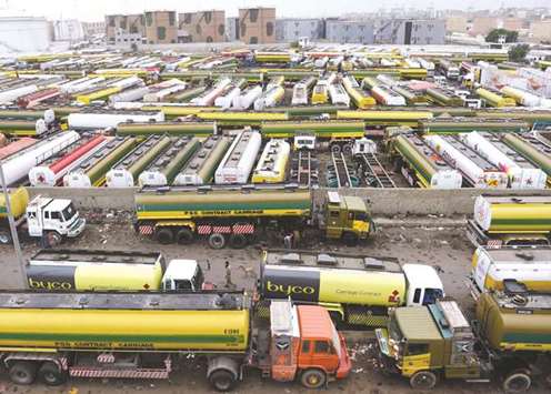 Oil tankers parked in a terminal amid a countrywide strike by the All Pakistan Oil Tankers Association near a port in Karachi yesterday.