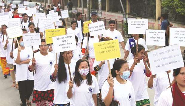 This file photo shows participants hold placards during a rally on the occasion of the National Anti-Human Trafficking Day in Kathmandu. September 5 is celebrated yearly to bring the awareness of stopping and preventing human trafficking.