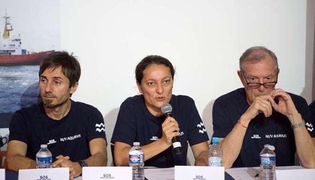 SOS Mediterranee general director Sophie Beau (C) gives a press conference, one day after the arrival of the Aquarius rescue ship, chartered by French NGOs SOS Mediterranee and Doctors Without Borders (MSF) at the harbour of Marseille for maintenance, on June 30, 2018 in Marseille, southern France.