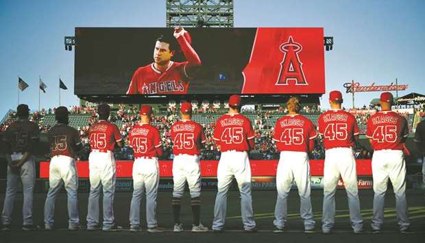 Los Angeles Angels bring Tyler Skaggs' jersey onto the field and