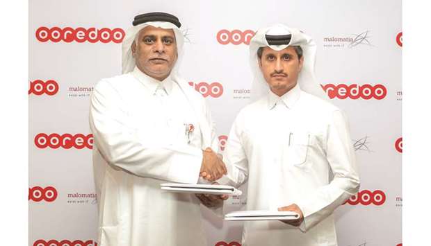 Ooredoo and malomatia officials after signing the agreement.