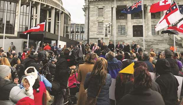 Ministers address hundreds of Maori protesters gathered to demonstrate against what protesters say is the disproportionate number of Maori children taken by social service agencies from their families, outside parliament in Wellington, yesterday.