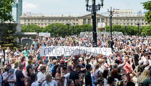 People hold a banner reading ,Freedom for Furgal!,, during an unauthorised rally in support of Sergei Furgal, the governor of the Khabarovsk region who was arrested a week ago, in the Russian far eastern city of Khabarovsk