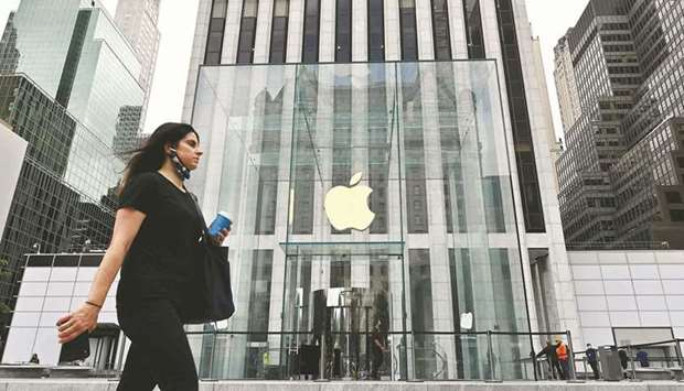 A woman walks past the Apple store on Fifth Avenue in New York City. The market value of the five biggest technology companies u2013 Apple, Microsoft Corp, Amazon.com, Alphabet and Facebook u2013 has surged more than $1tn since the beginning of June.