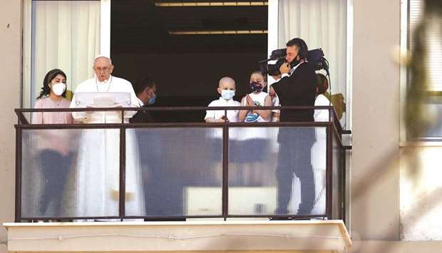 Pope Francis leads the Angelus prayer from a balcony of the Gemelli hospital following an ongoing recovery after a surgery on his colon in Rome yesterday. (Reuters)