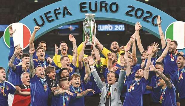 Italyu2019s defender Giorgio Chiellini raises the European Championship trophy during the presentation after Italy won the UEFA Euro 2020 final against England at Wembley.