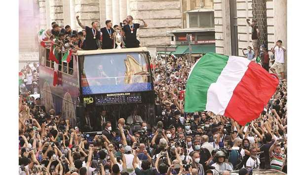 The Italy team drive through on a open top bus tour as fans celebrate the Euro 2020 triumph in Rome yesterday. (Reuters)