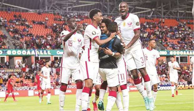 Qatar players celebrate after scoring a goal against Panama during the Concacaf Gold Cup match in Houston on Tuesday.