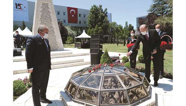 President Erdogan lays carnations at a monument in Ankara during a ceremony to mark the fifth anniversary of failed coup attempt.