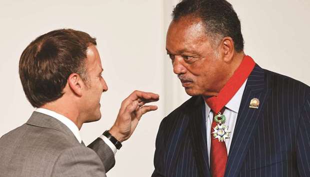 French President Emmanuel Macron (left) greets Reverend Jesse Jackson after awarding him with the Legion of Honour at the Elysee Palace yesterday. (Reuters)