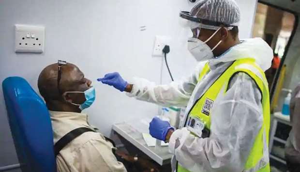 (File photo) South Africa is the worst-hit country in Africa, with new daily infections hitting record highs of 26,000 cases over the weekend, fuelled by the highly contagious Delta variant.(AFP)