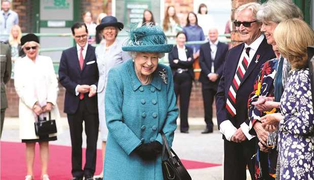 Queen Elizabeth is seen  during her visit to the set of the television series Coronation Street, in Manchester.