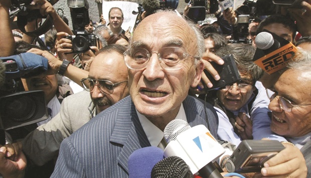 In this file photo taken on July 9, 2002, former Mexican president Echeverria is surrounded by the press in Mexico City.