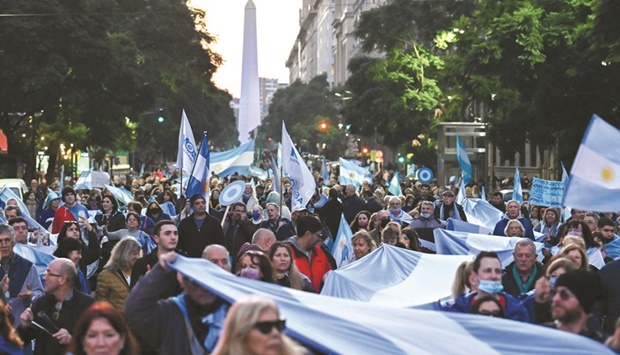 Protesters march on the Casa Rosada presidential palace in Buenos Aires.