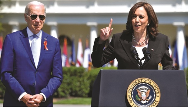 US Vice-President Harris speaks alongside US President Biden during an event commemorating the passage of the Safer Communities Act at the White House in Washington, DC.