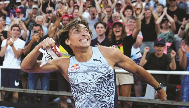 ?  Swedenu2019s Armand Duplantis celebrates after breaking the outdoor world record in the pole vault at the Swedish Diamond League in Stockholm on Thursday. (Reuters)