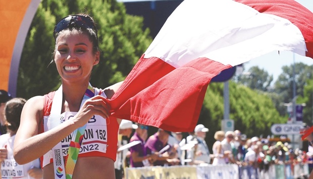 Peruu2019s Kimberly Garcia Leon celebrates after winning the womenu2019s 20km race walk final at the World Athletics Championships in Eugene, Oregon, on Friday. (Reuters)