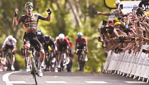 Jumbo-Visma teamu2019s French rider Christophe Laporte celebrates as he wins the 19th stage of the 109th edition of the Tour de France, a distance of 188.3km between Castelnau-Magnoac and Cahors, in southwestern France, yesterday. (AFP)