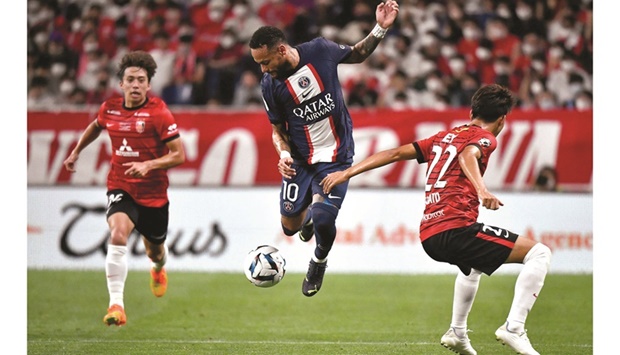 Paris Saint-Germainu2019s Brazilian forward Neymar (centre) controls the ball during the pre-season friendly against Japanu2019s Urawa Reds at the Saitama Stadium in Saitama yesterday. (AFP)