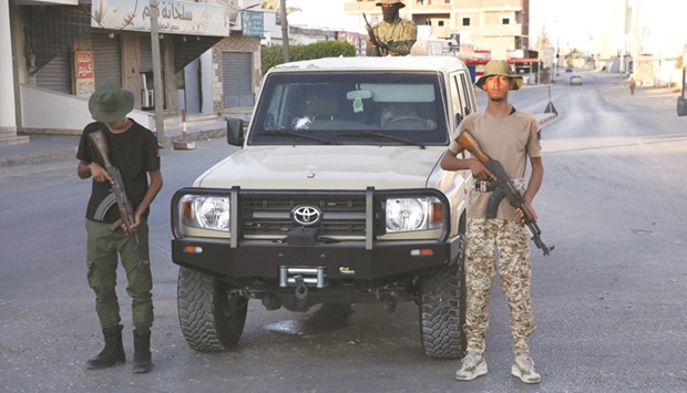 Members of the u201c444 Brigadeu201d affiliated with Libyau2019s ministry of defence man positions in the area of an overnight gunbattle in Tripoliu2019s suburb of Ain Zara, yesterday.