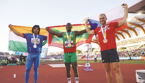 Silver-medallist Neeraj Chopra (left) of India, gold-medallist Anderson Peters of Grenada (centre) and bronze-medallist  Jakub Vadlejch of Czech Republic pose after medal ceremony for the javelin final of the World  Athletics Championships in Eugene. (Reuters)