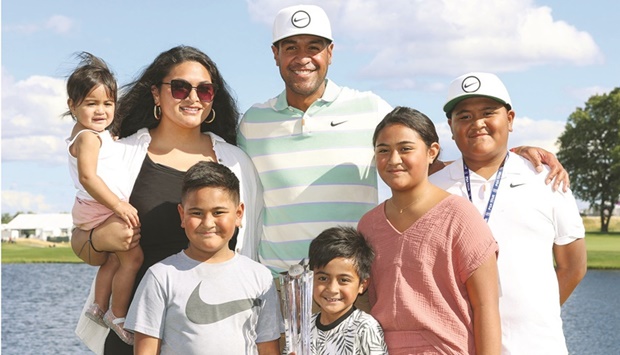 Tony Finau poses with his family and the trophy after winning the 3M Open in Blaine, Minnesota, USA. (USA TODAY Sports)