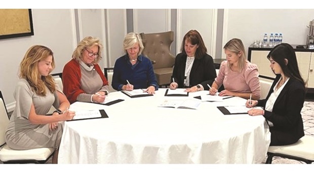AmCham executive directors signing the MoU. From left: Rebecca Olson (OABC AmCham Oman), Liz Beneski (Abu Dhabi), Mary McGinnis (Bahrain), Cara Nazari (Dubai), Brooke Holland (Qatar), and Paola de la Roche (Kuwait).