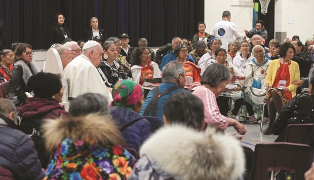 Pope Francis attends a meeting with former students of residential schools at the Nakasuk Elementary School in Iqaluit, Canada. (Reuters)