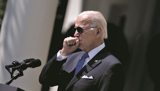 In this file photo taken on July 27, US President Joe Biden coughs while delivering remarks in the Rose Garden of the White House.  (AFP)