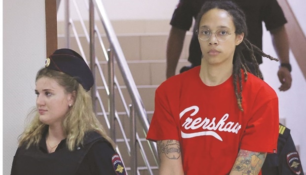 US basketball player Brittney Griner, who was detained in March at Moscowu2019s Sheremetyevo airport and later charged with illegal possession of cannabis, being escorted before a court hearing in Khimki outside Moscow yesterday. (Reuters)