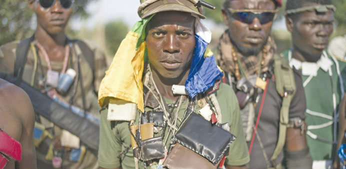 Members of the mainly Christian u2018anti-balakau2019 (anti-machete) militia stand guard in a Bangui neighbourhood.