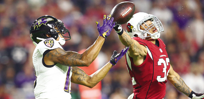 Cardinals hold off Ravens, 26-18