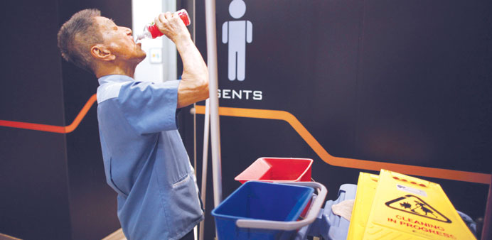 Eighty-year-old cleaner Lim Chin Seng takes a break from his job at a shopping mall in Singapore. Lim makes about S$1,000 ($800) a month, working eigh