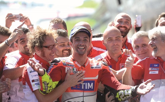 Ducati's Andrea Iannone of Italy (centre) celebrates with his team after winning the MotoGP Grand Prix of Austria in Spielberg. (AFP)