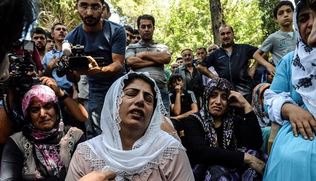 Women cry during a funeral for a victim of last night's attack on a wedding party that left 50 dead in Gaziantep in south eastern Turkey near the Syrian border on August 21, 2016.