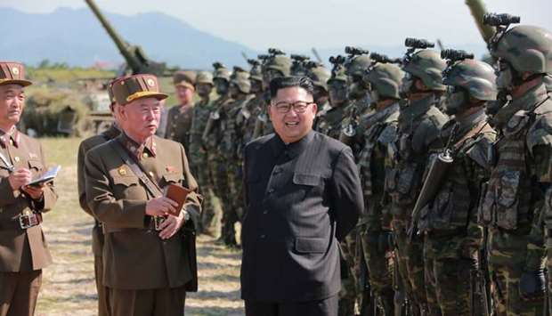 North Korean leader Kim Jong Un guides a target-striking contest of the special operation forces of the Korean People's Army (KPA) to occupy islands in this undated picture provided by KCNA in Pyongyang yesterday.