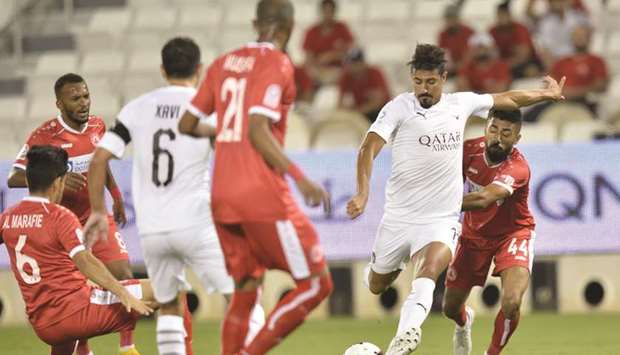 Al Saddu2019s Baghdad Bounedjah (second from right) in action against Al Arabi during their QNB Stars League match yesterday. PICTURES: Noushad Thekkayil