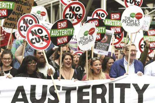 Tens of thousands marching against austerity measures in London in this 2015 file photo. The economic case against austerity is cut and dried: An economic downturn, by definition, implies shrinking private-sector expenditure.