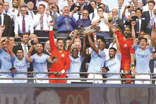 Manchester City players celebrate after winning the English FA Community Shield at Wembley Stadium in London on Sunday.  (AFP)