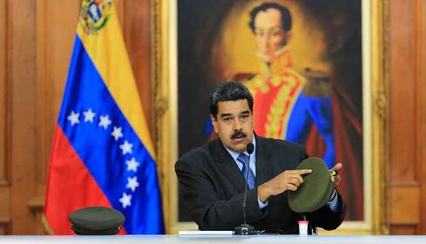 Venezuelan President Nicolas Maduro speaking during the broadcasting of a television programme, at the Miraflores presidential palace in Caracas.