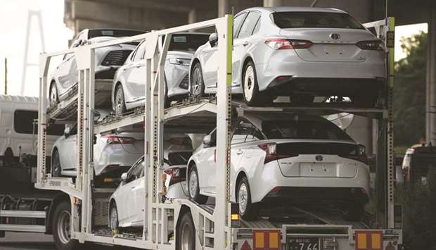 Toyota Motor vehicles are transported on a car carrier trailer at the Nagoya Port in Tokai, Japan.