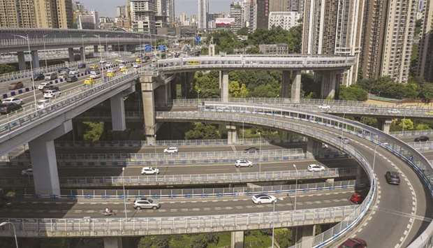 Vehicles travel along an elevated highway interchange in Chongqing, China. The final week of August may prove key for emerging markets attempting to erase this yearu2019s losses as investors fret that rising US-China tension will overshadow optimism about vaccine developments.